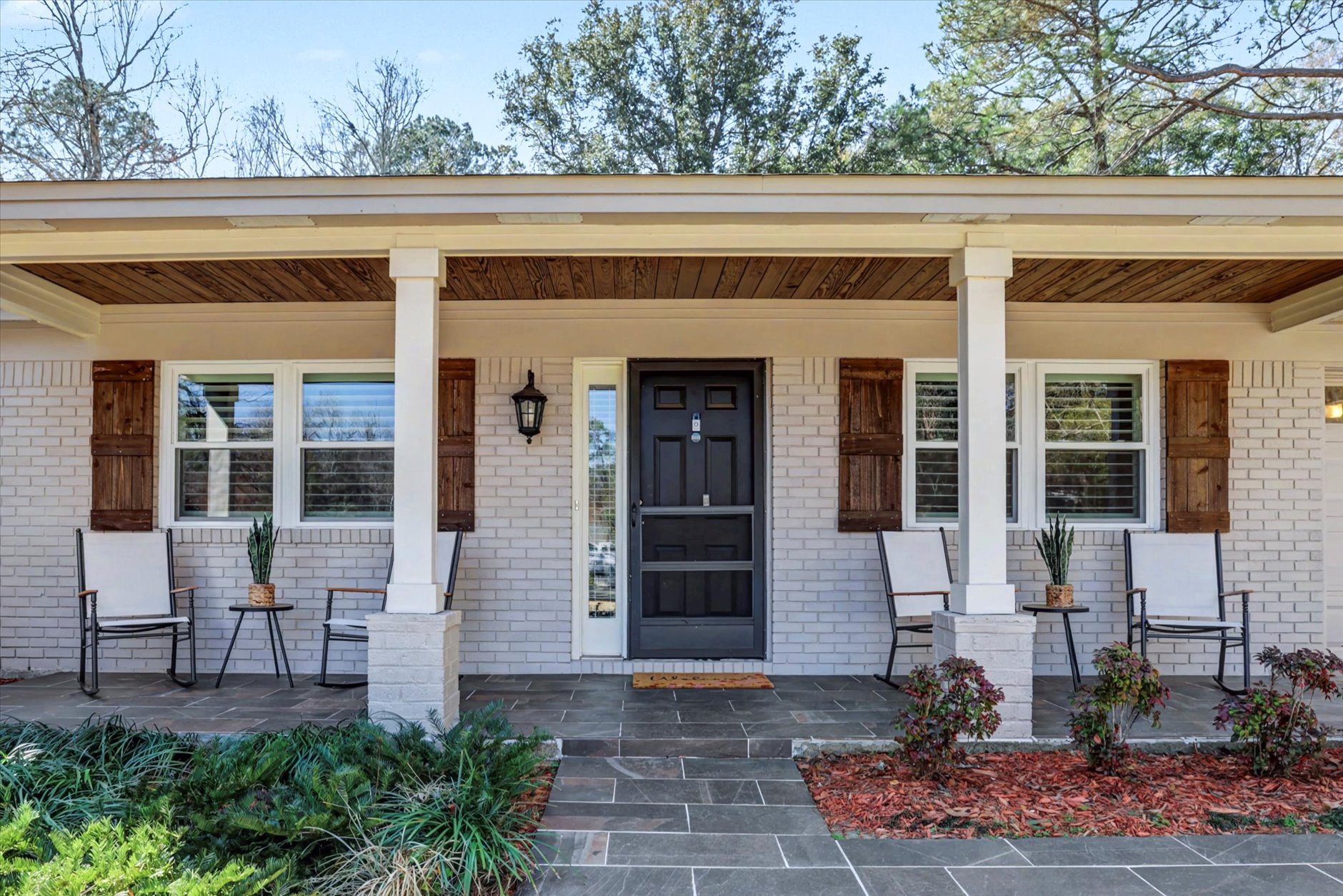 Front porch with rocking chairs at Shannon Lakes