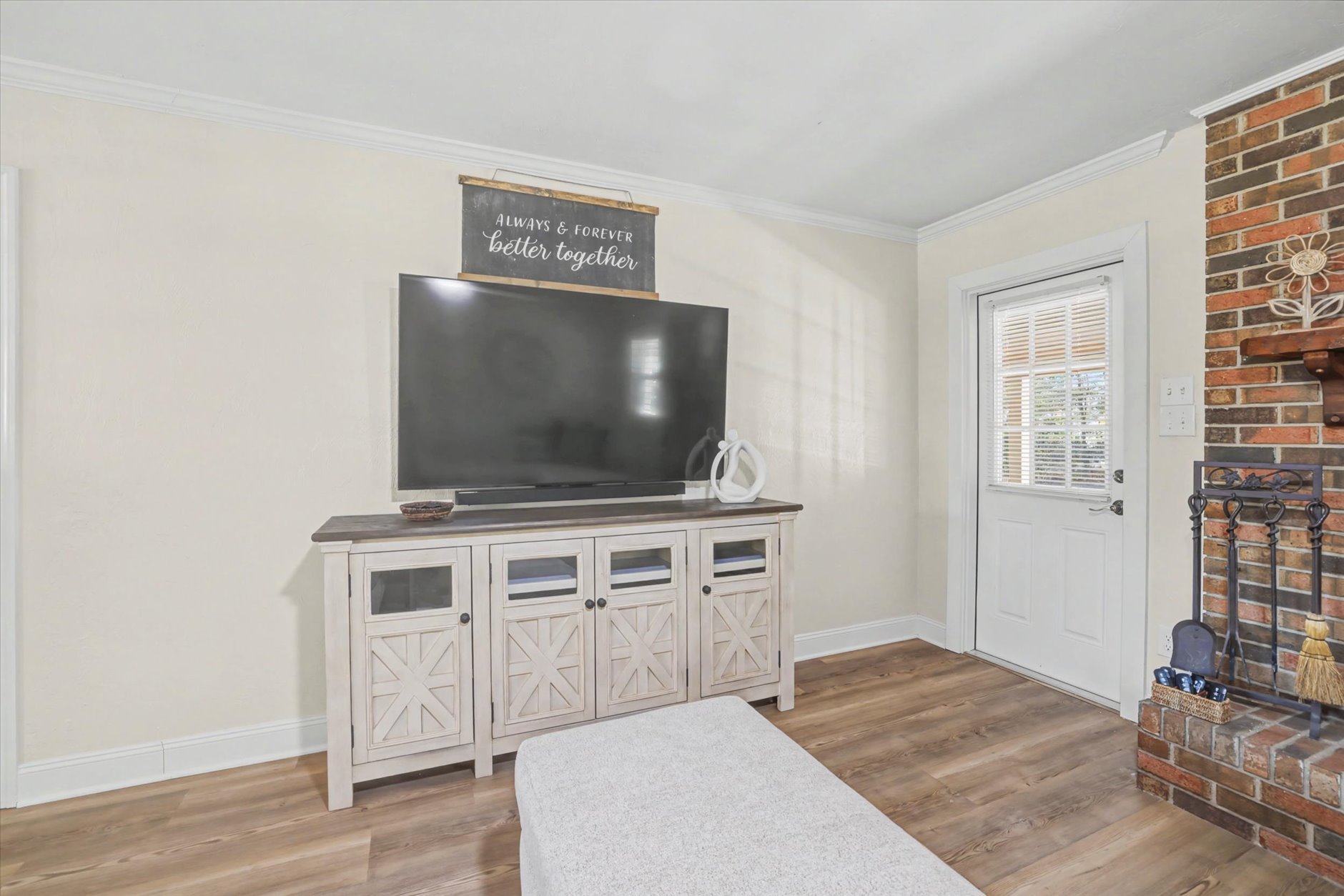 80 inch Smart TV and brick fireplace at Shannon Lakes