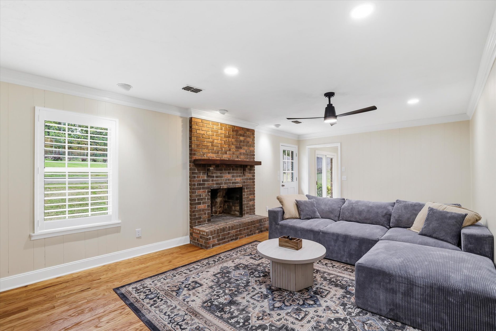 Living room with brick fireplace at Mahoney